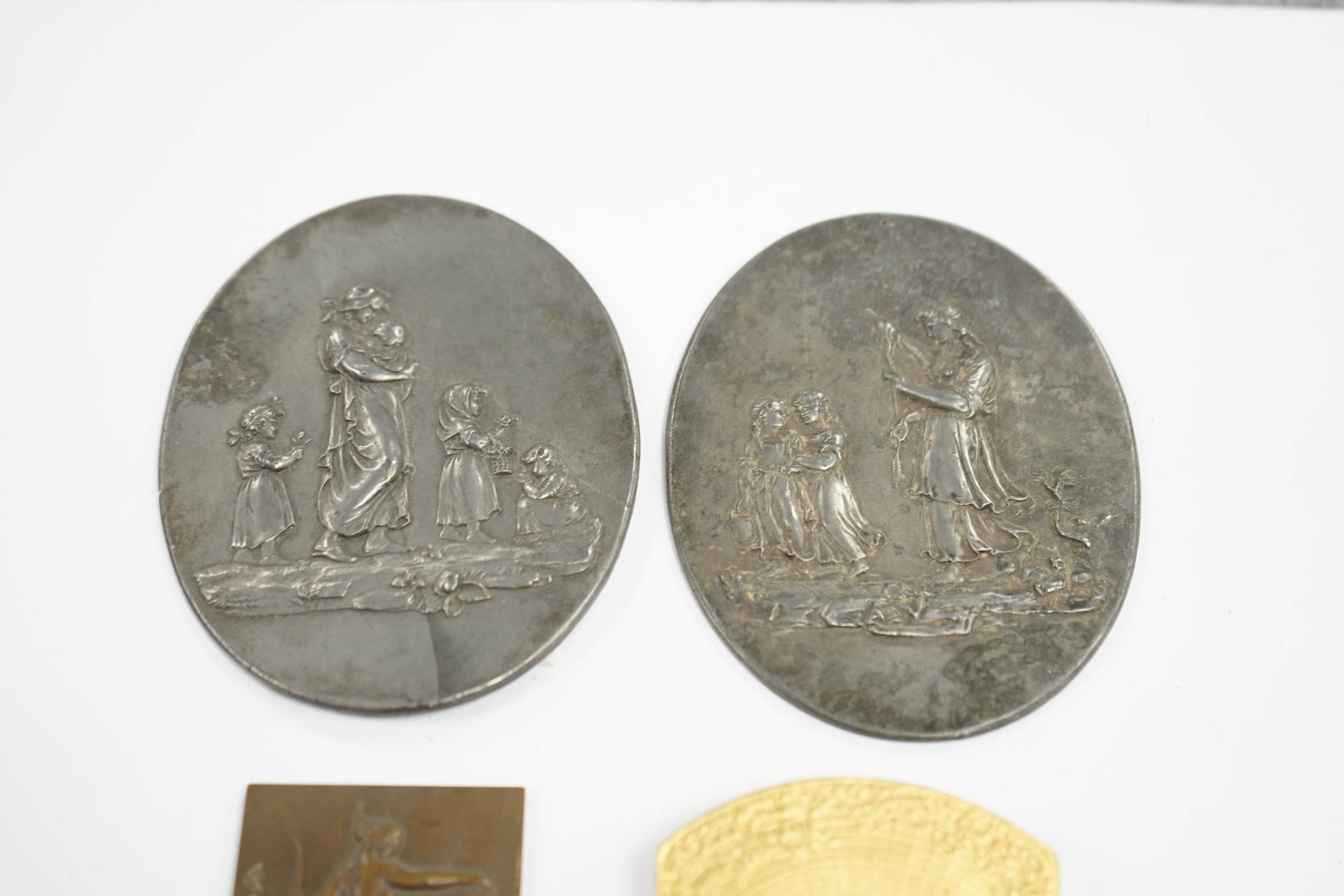 A pair of oval cast pewter plaques inscribed L. Jewitt, Duffield, and two relief-moulded brass plaques, signed Sporrong, Stockholm and G. De Vreese, oval plaques 13cm high. Condition - some marks to surface